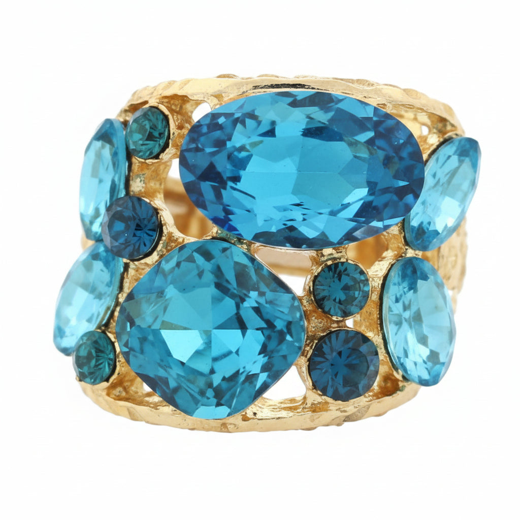 Gold tone ring with blue glass gemstones