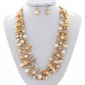 Necklace and earrings set on a mannequin bust with a white background