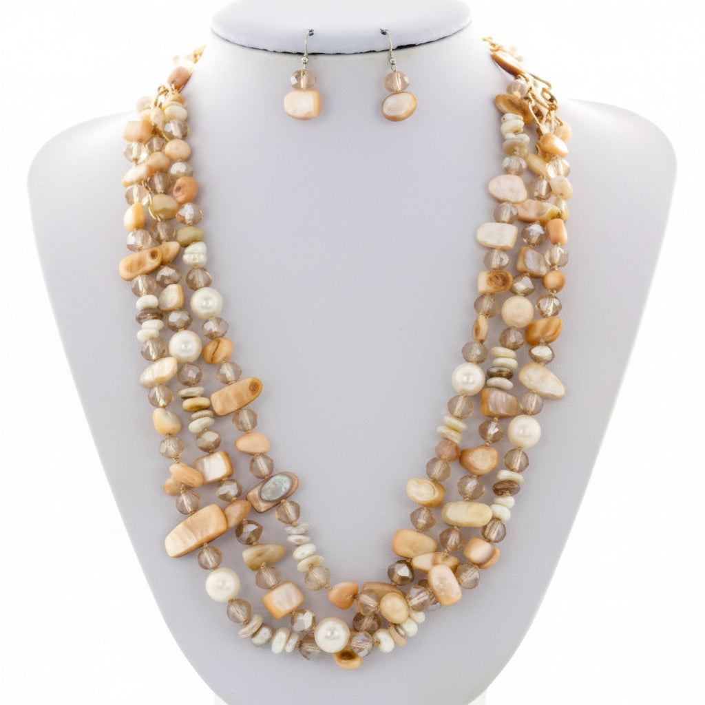 Necklace and earrings set on a mannequin bust with a white background