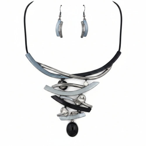 Necklace and earrings set with black and silver design on a white background