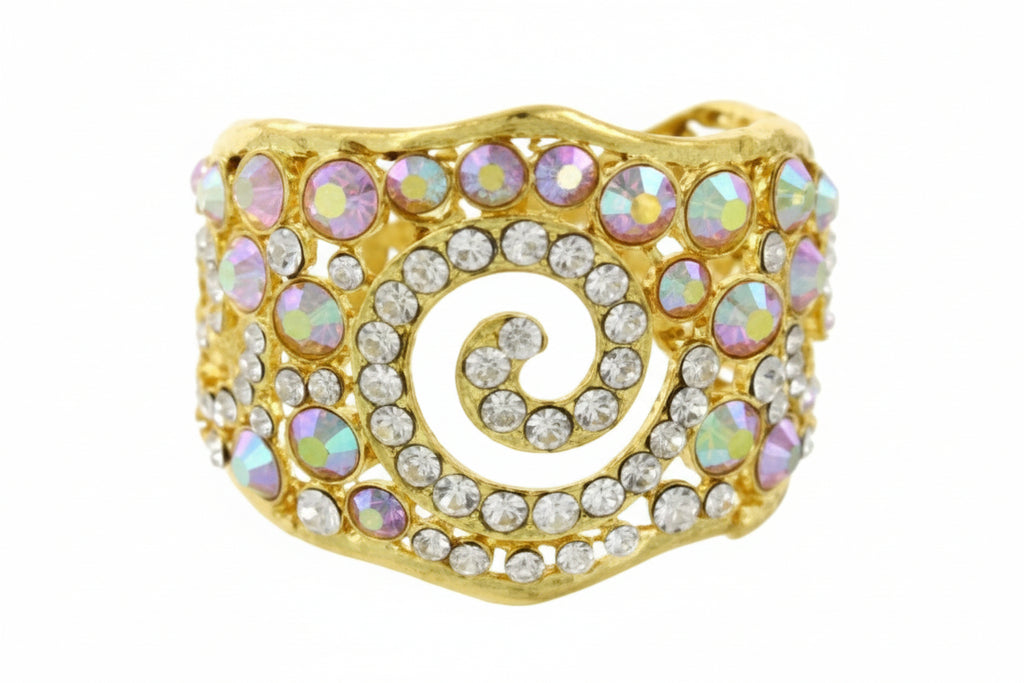Gold spiral bracelet with pink and white stones on a white background