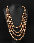A multi-strand wooden bead necklace displayed on a black mannequin bust against a black background, with a small white text box in the bottom right showing measurements and weight.
