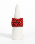 Red beaded bracelet on a white background