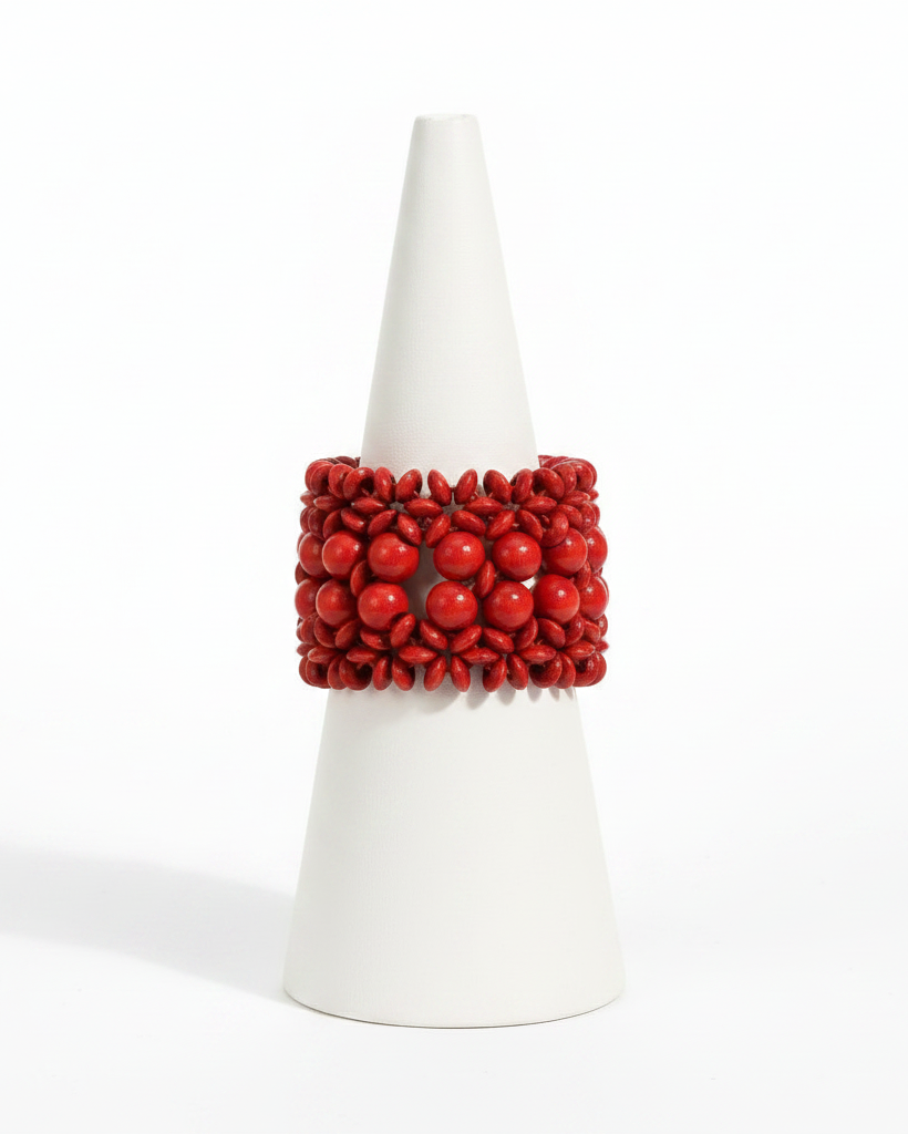 Red beaded bracelet on a white background