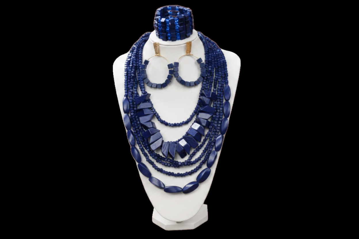 Blue beaded jewelry set on a white mannequin