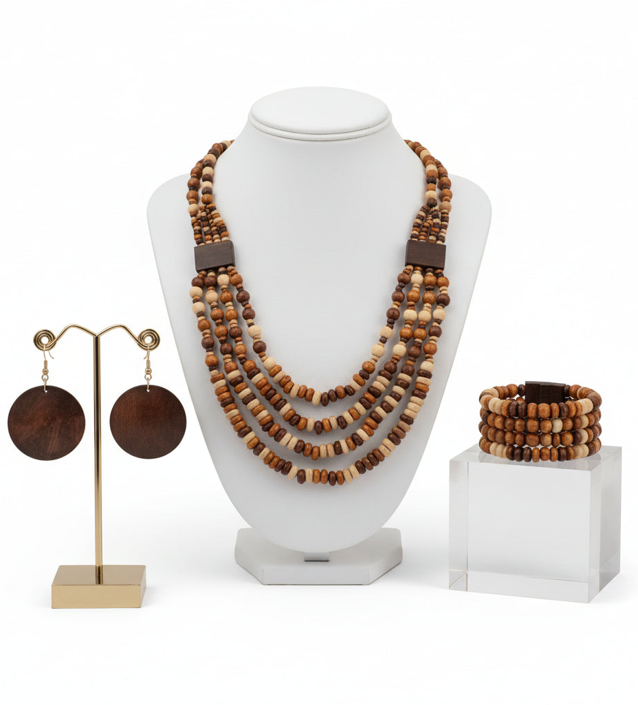 Wooden beaded necklace and earrings on a wooden surface with fall leaves.